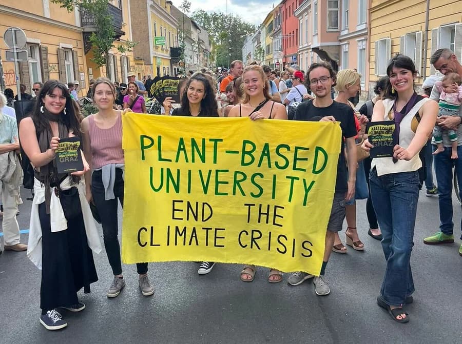 Graz campaigners holding their Plant-Based University banner at a march.