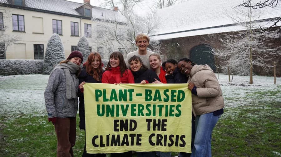 VUB campaigners holding a Plant-Based Universities banner in the snow.